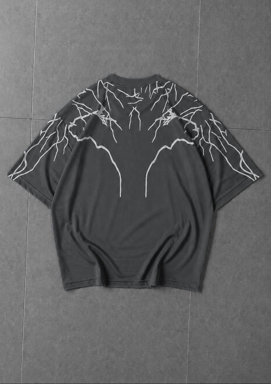Close-up of lightning print design on soft breathable t-shirt fabric