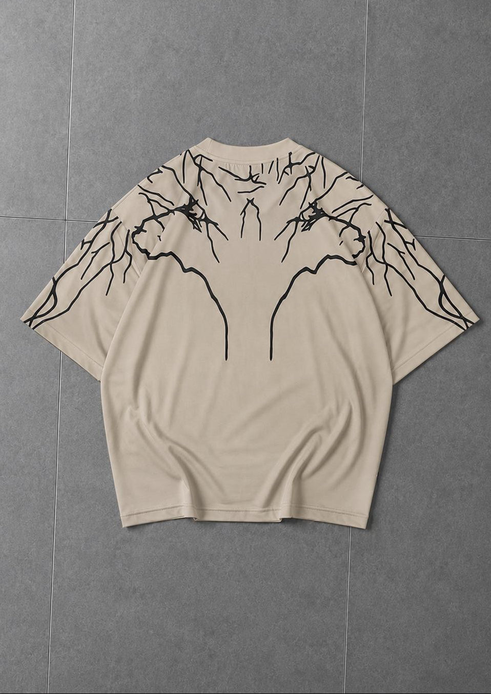 Man wearing oversized graphic t-shirt styled for casual street fashion