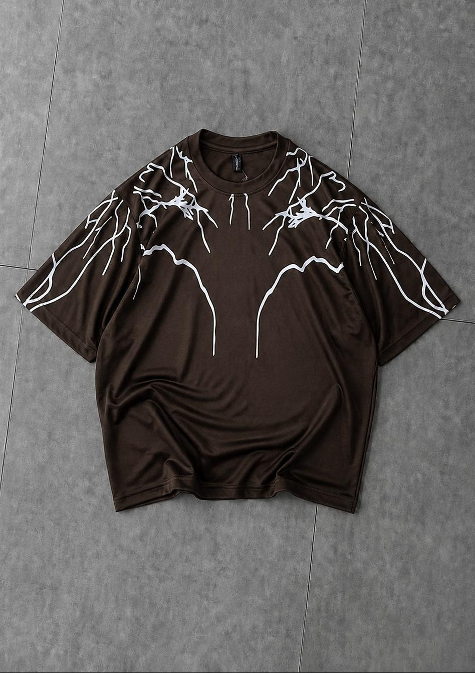 Brown oversized t-shirt featuring modern lightning print for trendy look