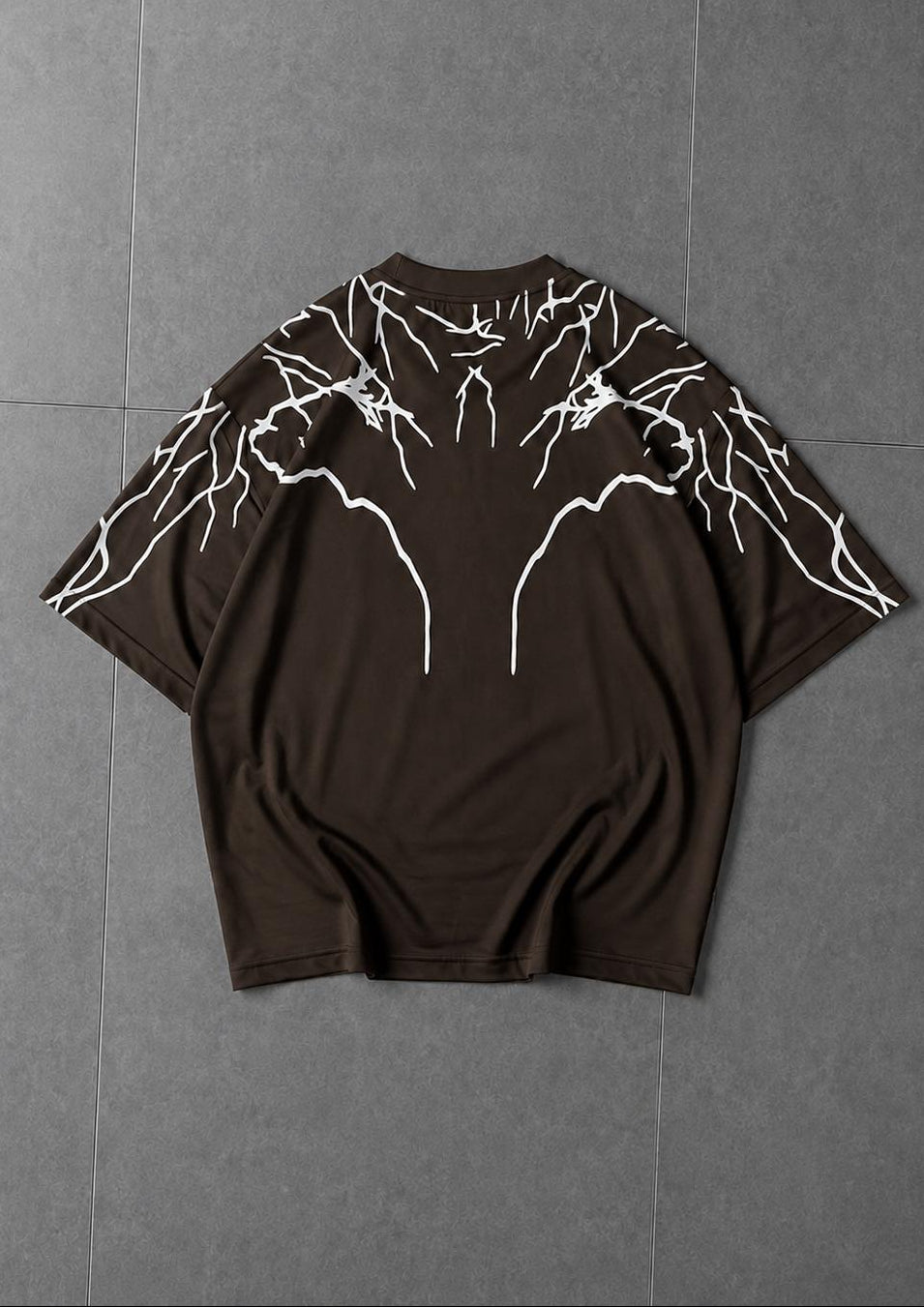 Flat lay of oversized graphic t-shirt showcasing premium quality design